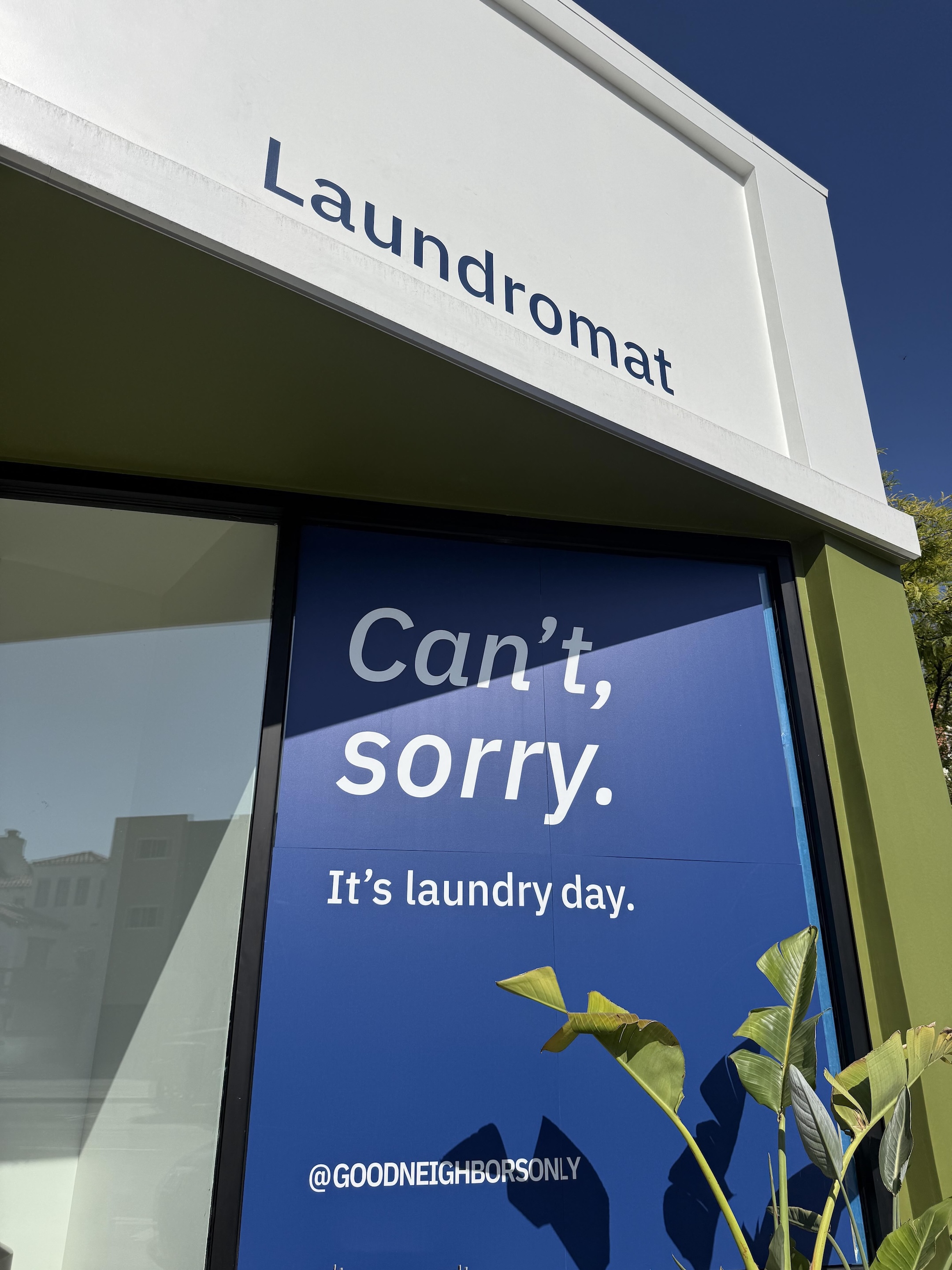 Good Neighbor laundromat exterior sign