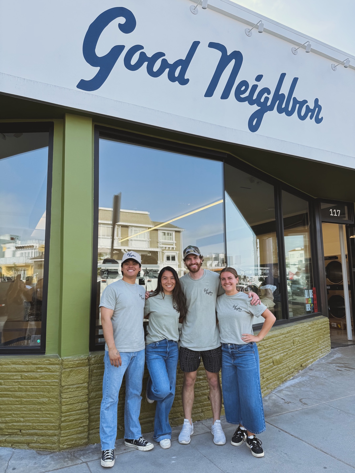 Good Neighbor team outside the finished laundromat